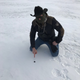 Private meteorite hunter Robert Ward pointing to his discovery on Strawberry Lake.